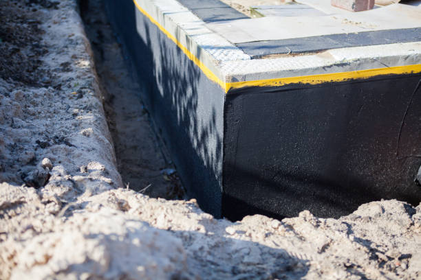 Professional Emergency Waterproofing technician working in Leonard, MI